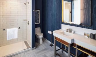 Private guest bathroom with shower at Rand Tower Hotel, Minneapolis, A Marriott Tribute Portfolio Hotel.