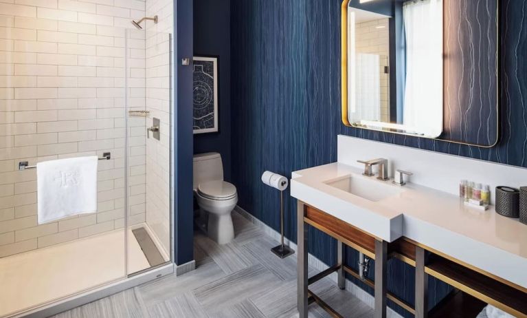 Private guest bathroom with shower at Rand Tower Hotel, Minneapolis, A Marriott Tribute Portfolio Hotel.