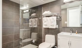 Guest bathroom with shower at Plunge Beach Resort.