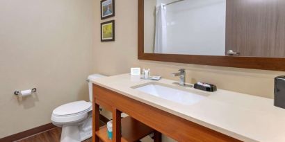 Guest bathroom with shower at Comfort Inn & Suites Mankato.