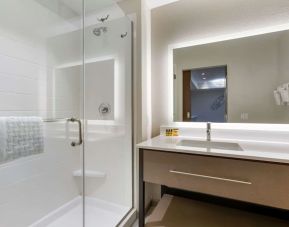 Guest bathroom with shower at Best Western Plus Executive Residency Phoenix North Happy Valley.