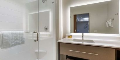 Guest bathroom with shower at Best Western Plus Executive Residency Phoenix North Happy Valley.