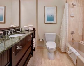 Private guest bathroom with free toiletries at Embassy Suites By Hilton San Diego-La Jolla.