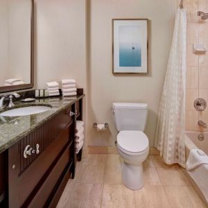 Private guest bathroom with free toiletries at Embassy Suites By Hilton San Diego-La Jolla.