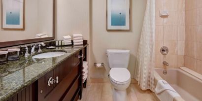 Private guest bathroom with free toiletries at Embassy Suites By Hilton San Diego-La Jolla.