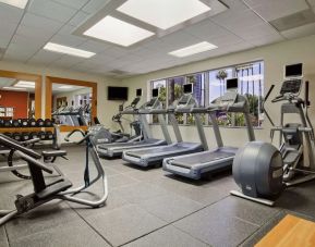 Fully equipped fitness center at Embassy Suites By Hilton San Diego-La Jolla.