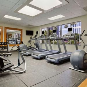 Fully equipped fitness center at Embassy Suites By Hilton San Diego-La Jolla.