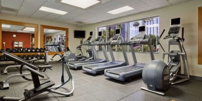 Fully equipped fitness center at Embassy Suites By Hilton San Diego-La Jolla.