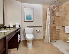 Accesible private guest bathroom with shower at Embassy Suites By Hilton San Diego-La Jolla.