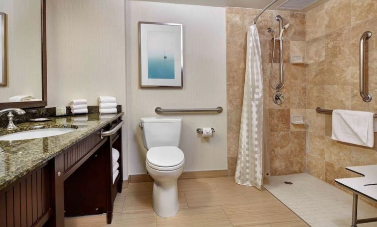 Accesible private guest bathroom with shower at Embassy Suites By Hilton San Diego-La Jolla.