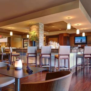 Hotel bar with lounge seating at Embassy Suites By Hilton San Diego-La Jolla.