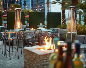 Outdoor patio at Embassy Suites By Hilton San Diego-La Jolla.