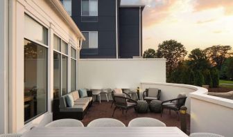 Outdoor terrace with lounge seating at Hilton Garden Inn Kennett Square.