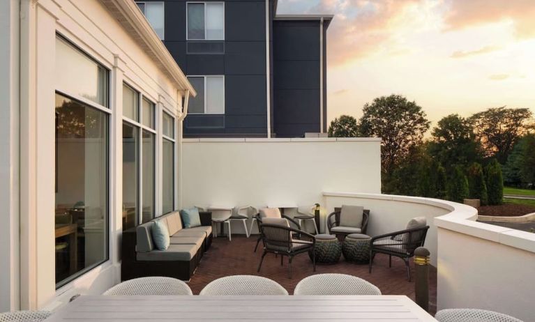 Outdoor terrace with lounge seating at Hilton Garden Inn Kennett Square.