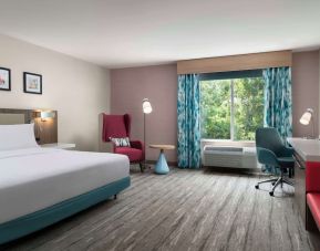 Bright and spacious day use room with work desk and lounge seating at Hilton Garden Inn Kennett Square.