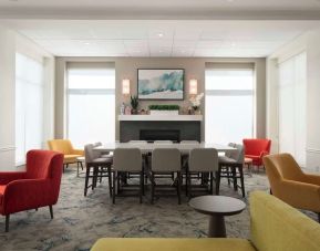 Lobby lounge with comfortable seating and workspace at Hilton Garden Inn Kennett Square.