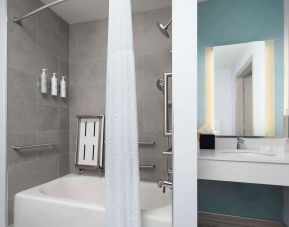 Private guest bathroom with convined tub and shower at Hilton Garden Inn Kennett Square.