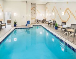 Indoor pool with lounge chairs at Hilton Garden Inn Washington DC Downtown.