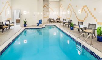 Indoor pool with lounge chairs at Hilton Garden Inn Washington DC Downtown.