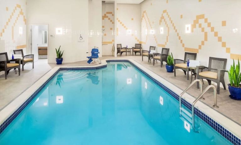 Indoor pool with lounge chairs at Hilton Garden Inn Washington DC Downtown.