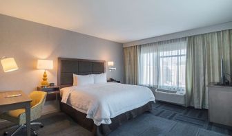 King bed with work desk at Hampton Inn Chicago North/Loyola Station.