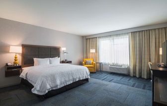 Spacious day use room with king bed at Hampton Inn Chicago North/Loyola Station.