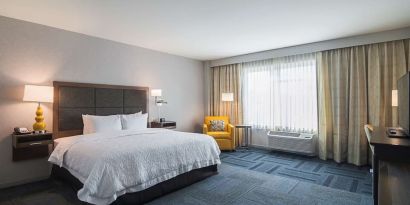 Spacious day use room with king bed at Hampton Inn Chicago North/Loyola Station.