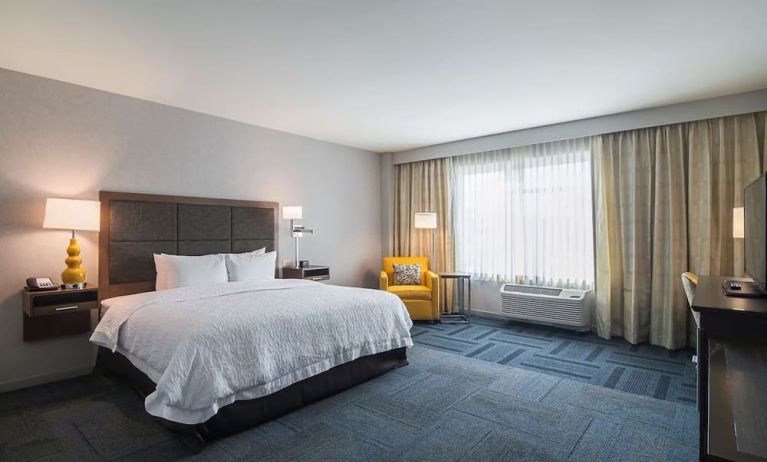 Spacious day use room with king bed at Hampton Inn Chicago North/Loyola Station.