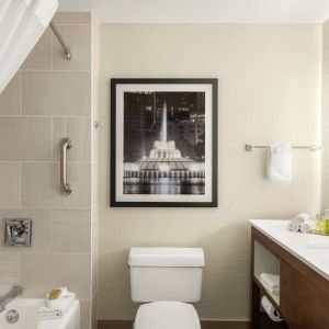 Guest bathroom with shower and tub at DoubleTree By Hilton Orlando Downtown.
