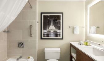 Guest bathroom with shower and tub at DoubleTree By Hilton Orlando Downtown.
