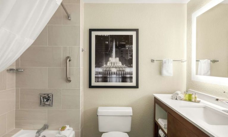 Guest bathroom with shower and tub at DoubleTree By Hilton Orlando Downtown.
