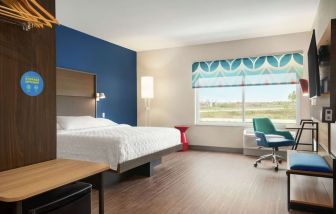 Spacious day use room with work desk at Tru By Hilton Milwaukee Brookfield.