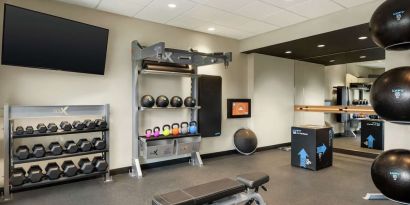 Fitness center at Tru By Hilton Milwaukee Brookfield.