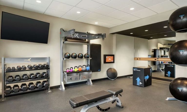 Fitness center at Tru By Hilton Milwaukee Brookfield.