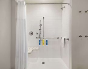 Guest bathroom with shower at Tru By Hilton Milwaukee Brookfield.