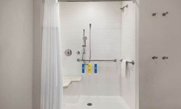 Guest bathroom with shower at Tru By Hilton Milwaukee Brookfield.