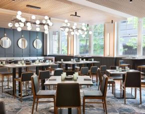 Dining area perfect for coworking at The Slate Denver, Tapestry Collection By Hilton.