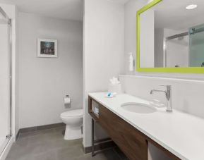 Guest bathroom with shower at Hampton Inn & Suites Phoenix/Gilbert.