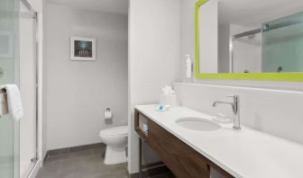 Guest bathroom with shower at Hampton Inn & Suites Phoenix/Gilbert.