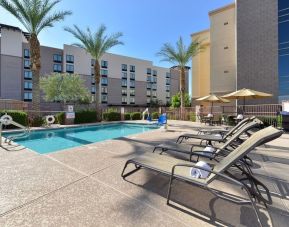 Sun loungers beside the pool at Hampton Inn & Suites Phoenix/Gilbert.