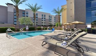 Sun loungers beside the pool at Hampton Inn & Suites Phoenix/Gilbert.