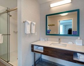 Guest bathroom with shower at Hampton Inn & Suites Sunnyvale Silicon Valley.