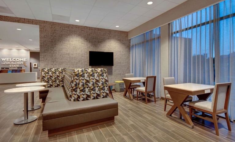 Lobby and coworking lounge at Hampton Inn & Suites Sunnyvale Silicon Valley.