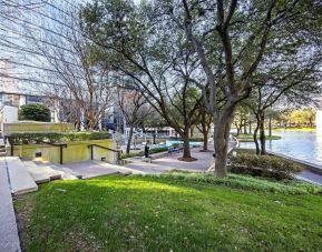 Courtyard beside private lake at Hilton Dallas Lincoln Centre.