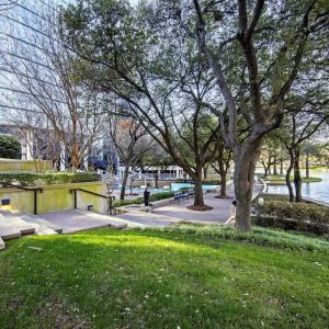 Courtyard beside private lake at Hilton Dallas Lincoln Centre.