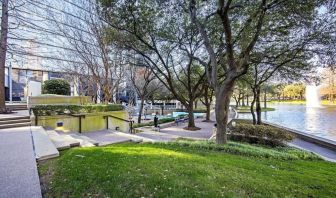 Courtyard beside private lake at Hilton Dallas Lincoln Centre.