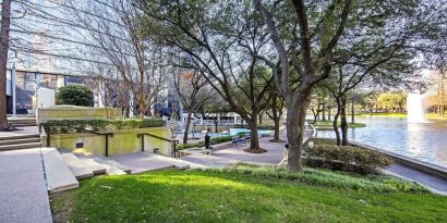 Courtyard beside private lake at Hilton Dallas Lincoln Centre.