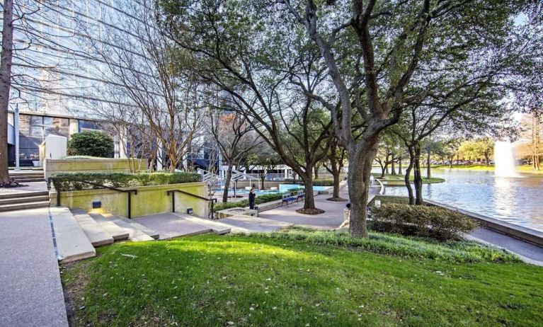 Courtyard beside private lake at Hilton Dallas Lincoln Centre.