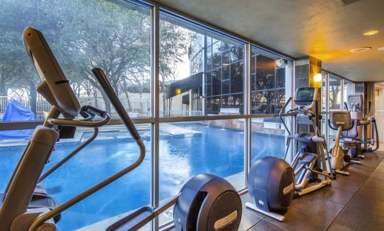 Fitness center overlooking the pool at Hilton Dallas Lincoln Centre.