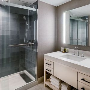 Guest bathroom with shower at Hilton Dallas Lincoln Centre.